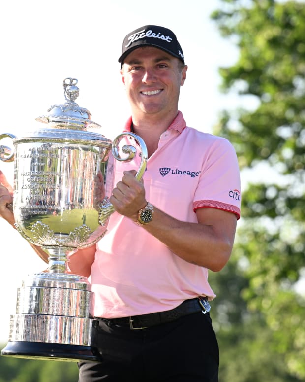 Justin Thomas poses with the Wanamaker trophy after winning the PGA Championship golf tournament at Southern Hills Country Club.
