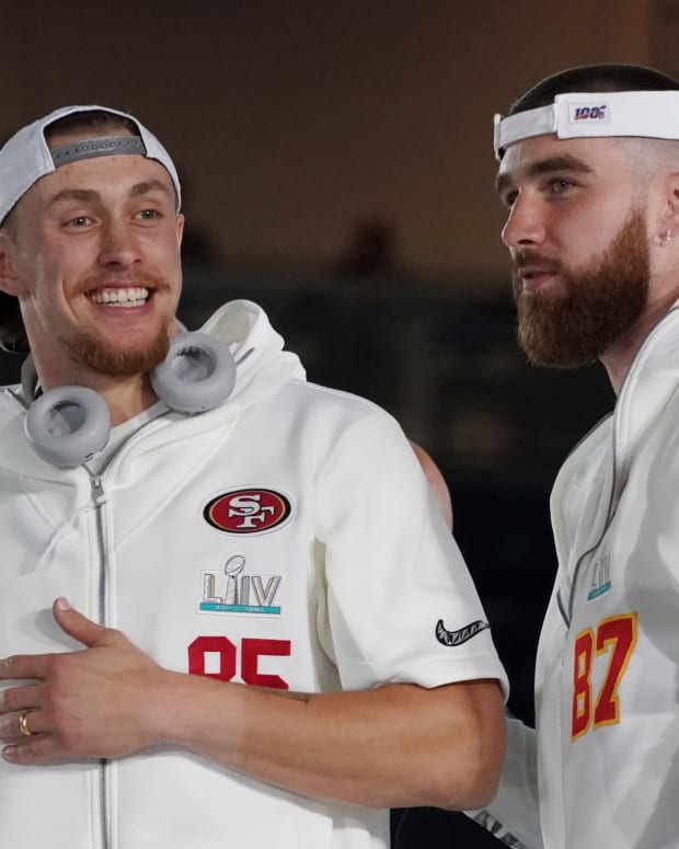 Jan 27, 2020; Miami, FL, USA; San Francisco 49ers tight end George Kittle (85) greets Kansas City Chiefs tight end Travis Kelce (87) during Super Bowl LIV Opening Night at Marlins Park. Mandatory Credit: Kirby Lee-USA TODAY Sports
