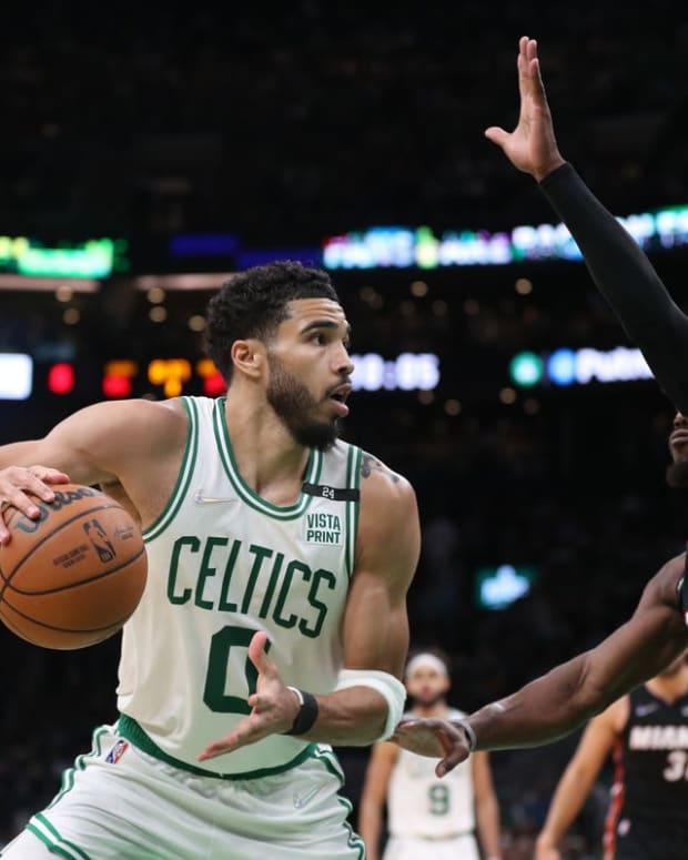 May 23, 2022; Boston, Massachusetts, USA; Boston Celtics forward Jayson Tatum (0) looks to move the ball defended by Miami Heat forward Jimmy Butler (22) in the second half during game four of the 2022 eastern conference finals at TD Garden. Mandatory Credit: Paul Rutherford-USA TODAY Sports