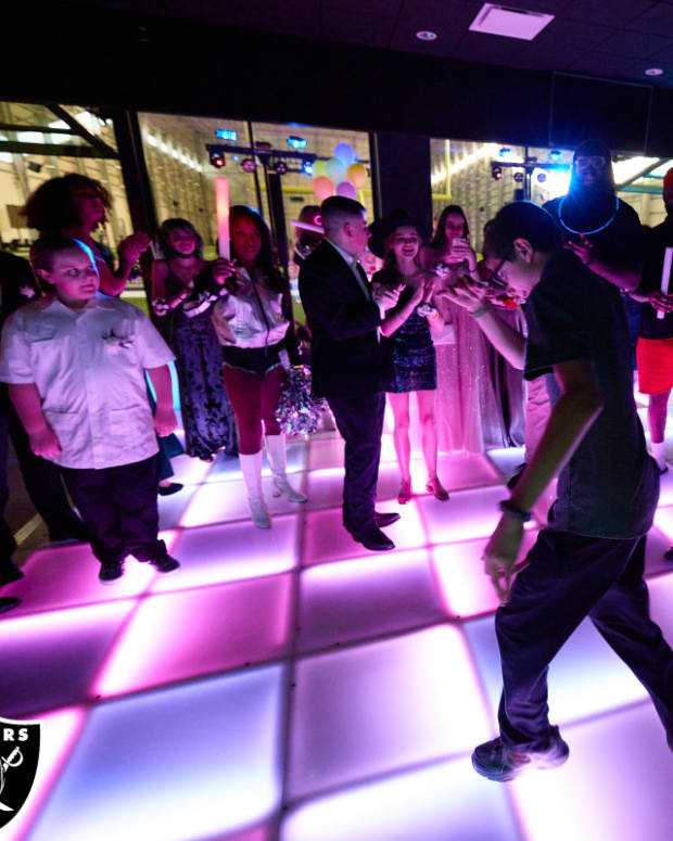 PHOTO 3-Guests dance in Raiders dining room which was transformed into a ballroom for the prom