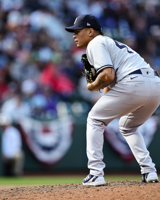 New York Yankees RP Jonathan Loaisiga leaning on pitcher's mound