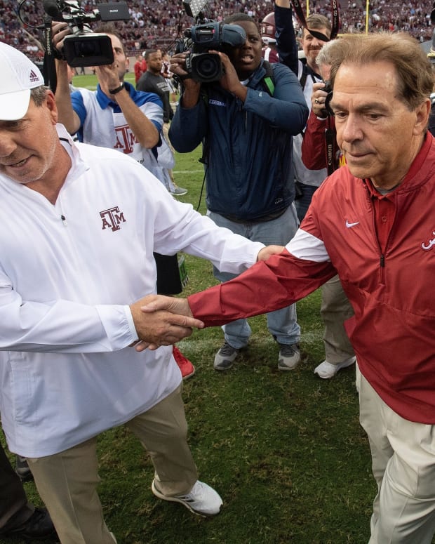 Texas A&M coach Jimbo Fisher and Alabama coach Nick Saban shake hands at midfield after their game at Kyle Field in College Station, Texas, on Saturday, Oct. 12, 2019.