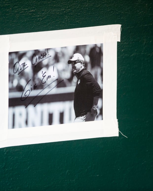 A photo of Texas A&M football coach Jimbo Fisher hangs in the Aggies dugout as they take on Alabama Crimson Tide during the SEC baseball tournament at the Hoover Metropolitan Stadium in Hoover, Ala., on Friday, May 27, 2022.