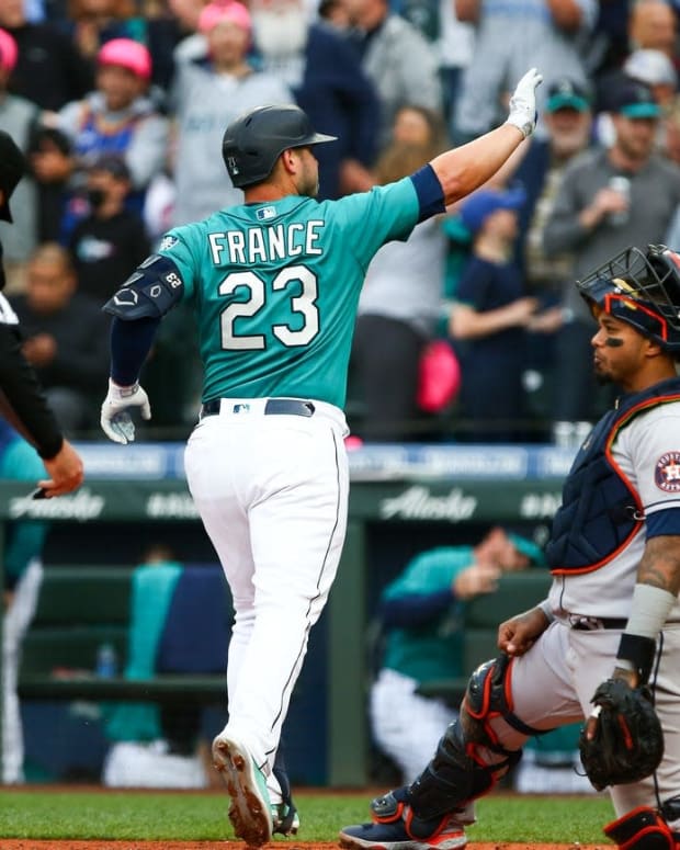 May 27, 2022; Seattle, Washington, USA; Seattle Mariners first baseman Ty France (23) waves as he crosses home after hitting a home run against the Houston Astros during the third inning at T-Mobile Park. Mandatory Credit: Lindsey Wasson-USA TODAY Sports