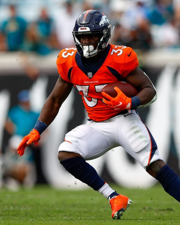 Denver Broncos running back Javonte Williams (33) runs with with ball in the fourth quarter against the Jacksonville Jaguars at TIAA Bank Field.