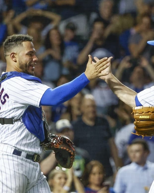 May 31, 2022; Chicago, Illinois, USA; Chicago Cubs relief pitcher David Robertson (R) celebrates with catcher Willson Contreras (L) after a win against the Milwaukee Brewers at Wrigley Field. Mandatory Credit: Kamil Krzaczynski-USA TODAY Sports