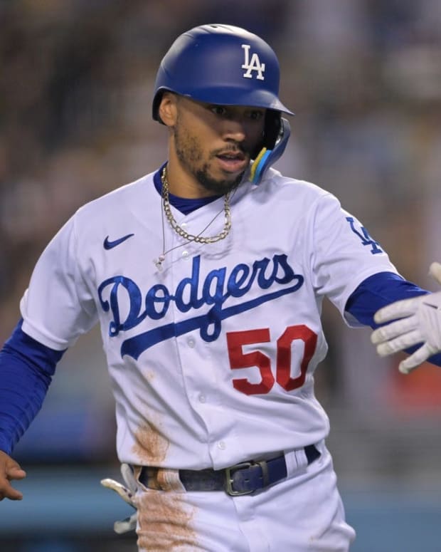 Jun 3, 2022; Los Angeles, California, USA; Los Angeles Dodgers right fielder Mookie Betts (50) celebrates after scoring on a RBI single by shortstop Trea Turner (not pictured) in the seventh inning against the New York Mets at Dodger Stadium. Mandatory Credit: Jayne Kamin-Oncea-USA TODAY Sports