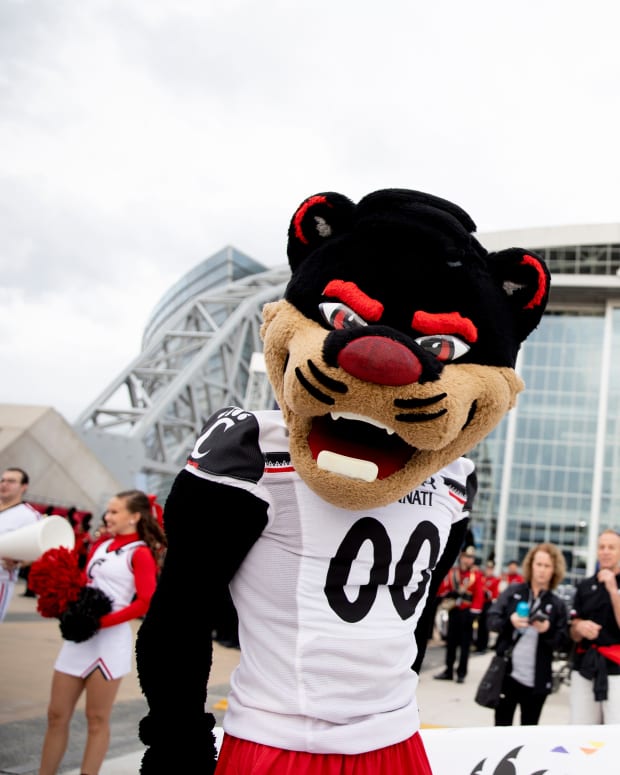 Cincinnati Bearcats mascot stands during the Cotton Bowl's Battle of the Bands outside AT&T Stadium in Arlington, Texas, on Thursday, Dec. 30, 2021. Cotton Bowl S Battle Of The Bands Ac 346