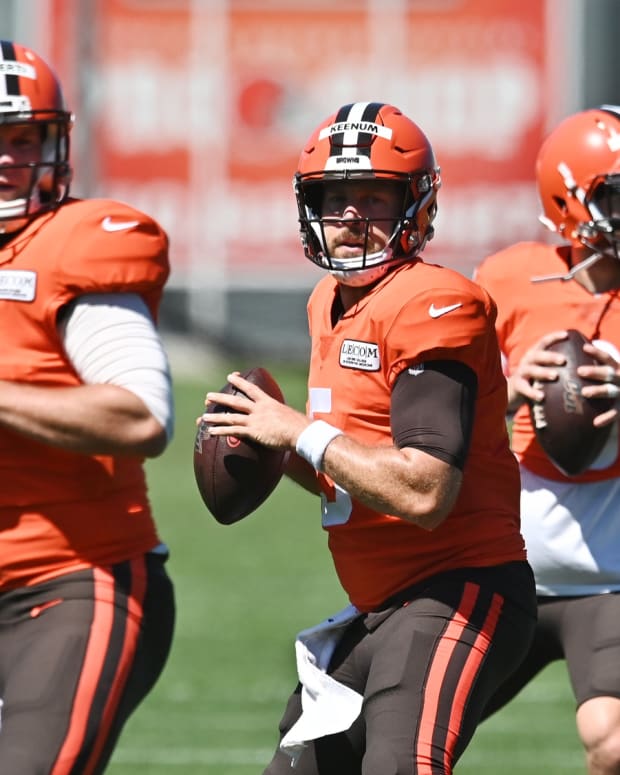 Aug 19, 2020; Berea, Ohio, USA; Cleveland Browns quarterback Case Keenum (center) works on a drill wit quarterback Garrett Gilbert (left) and quarterback Baker Mayfield (right) during training camp at the Cleveland Browns training facility. Mandatory Credit: Ken Blaze-USA TODAY Sports