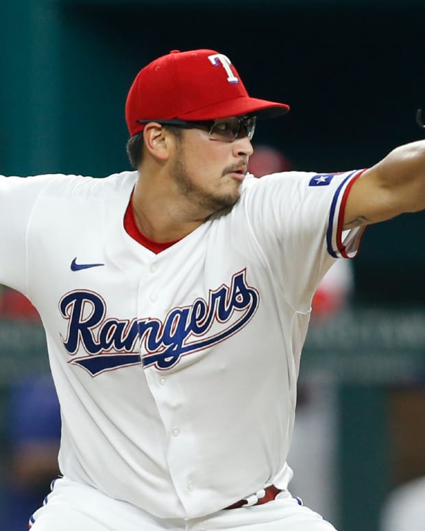 Aug 2, 2021; Arlington, Texas, USA; Texas Rangers starting pitcher Dane Dunning (33) pitches in the first inning against the Los Angeles Angels at Globe Life Field.