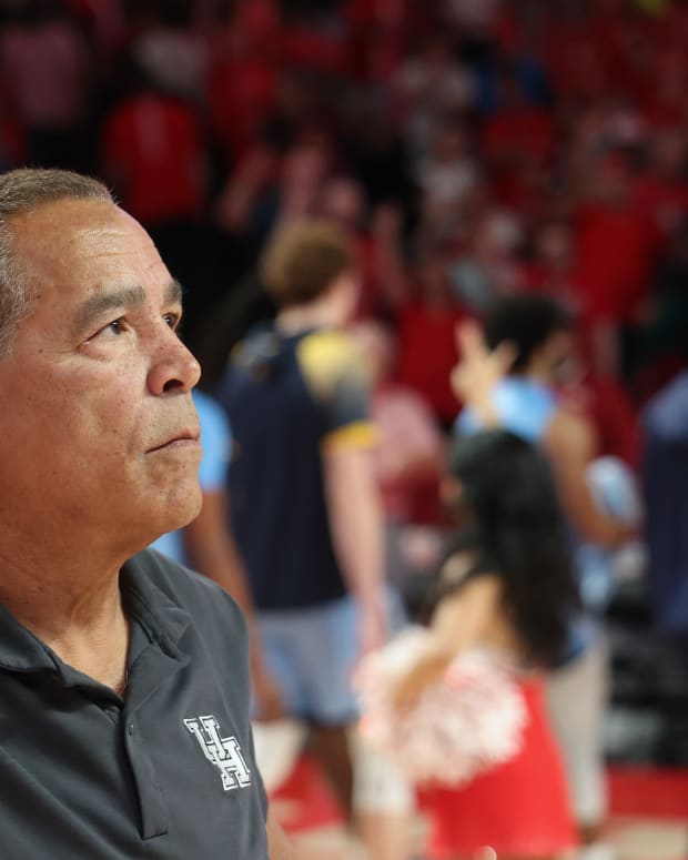 Nov 26, 2022; Houston, Texas, USA; Houston Cougars head coach Kelvin Sampson stands for the school song after defeating the Kent State Golden Flashes at the Fertitta Center. Mandatory Credit: Thomas Shea-USA TODAY Sports
