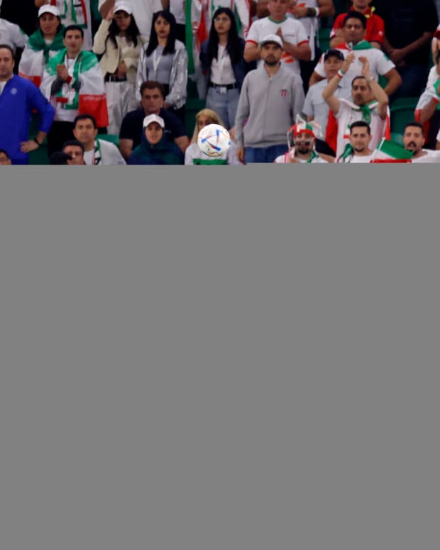 Iran midfielder Saeid Ezatolahi heads the ball against United States of America midfielder Yunus Musah during World Cup