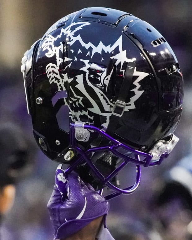 Nov 26, 2022; Fort Worth, Texas, USA; A TCU helmet raised in the air during second half against the Iowa State Cyclones at Amon G. Carter Stadium.