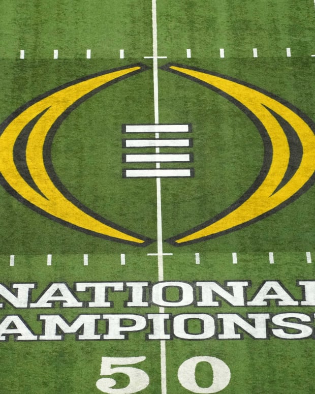 A detailed view of the CFP logo at midfield during the 2022 CFP college football national championship game between the Alabama Crimson Tide and the Georgia Bulldogs at Lucas Oil Stadium.