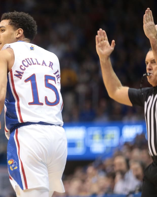 Kansas redshirt senior guard Kevin McCullar Jr. (15) looks back after sinking a three during the first half of Thursday's game against Seton Hall inside Allen Fieldhouse.