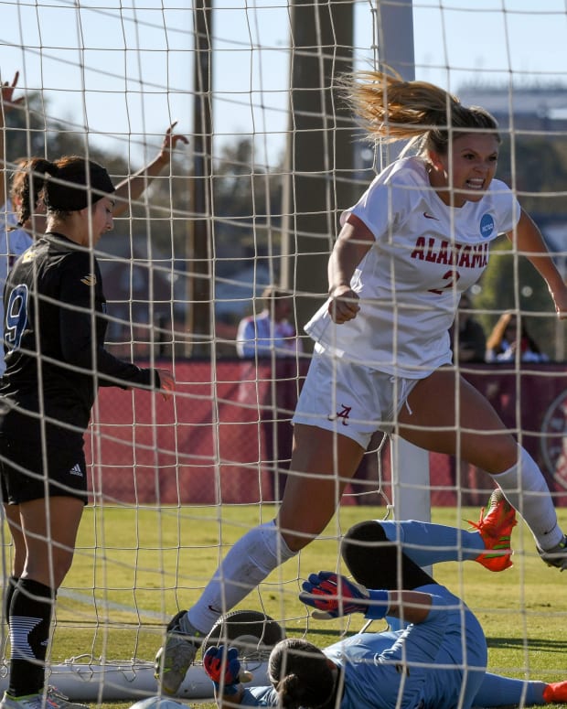 Alabama midfielder Macy Clem (2) celebrates in the UC Irvine goal after scoring on a corner kick at the Alabama Soccer Complex Sunday. The Crimson Tide advanced to the Elite Eight round of the NCAA Tournament with a 3-1 win.