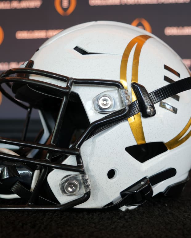 A detailed view of a helmet with the College Football Playoff logo at CFP press conference at Banc of California Stadium.