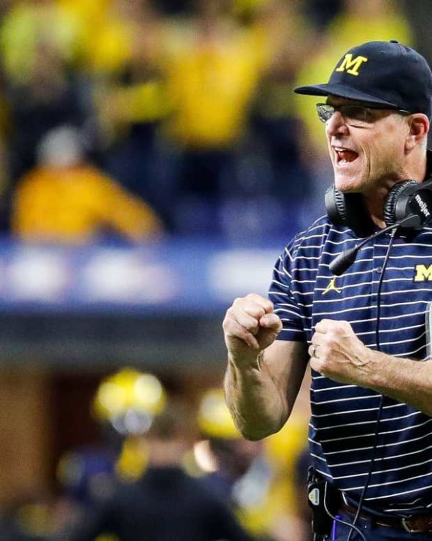 Michigan head coach Jim Harbaugh celebrates scoring a two point conversion against Purdue during the second half of the Big Ten Championship game against Purdue at Lucas Oil Stadium in Indianapolis, Ind., on Saturday, Dec. 3, 2022.