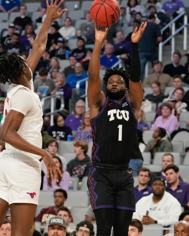 Dec 10, 2022; Fort Worth, Texas, USA; TCU Horned Frogs guard Mike Miles Jr. (1) makes a three point basket against Southern Methodist Mustangs forward Keon Ambrose-Hylton (22) during the first half at Dickies Arena.