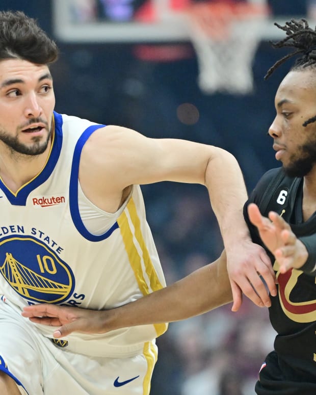 Golden State Warriors guard Ty Jerome (10) drives to the basket against Cleveland Cavaliers guard Darius Garland (10) during the first half at Rocket Mortgage FieldHouse.