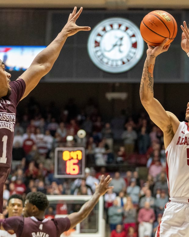 Alabama Crimson Tide guard Jahvon Quinerly (5) shoots against Mississippi State Bulldogs forward Tolu Smith (1) during the second half at Coleman Coliseum.