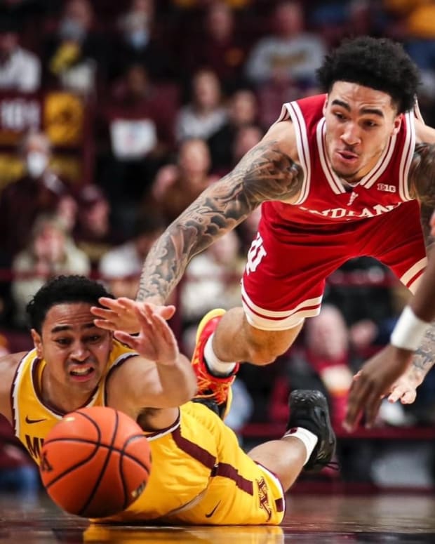 Indiana guard Jalen Hood-Schifino battles for a loose ball against the Minnesota Golden Gophers during Wednesday's game.