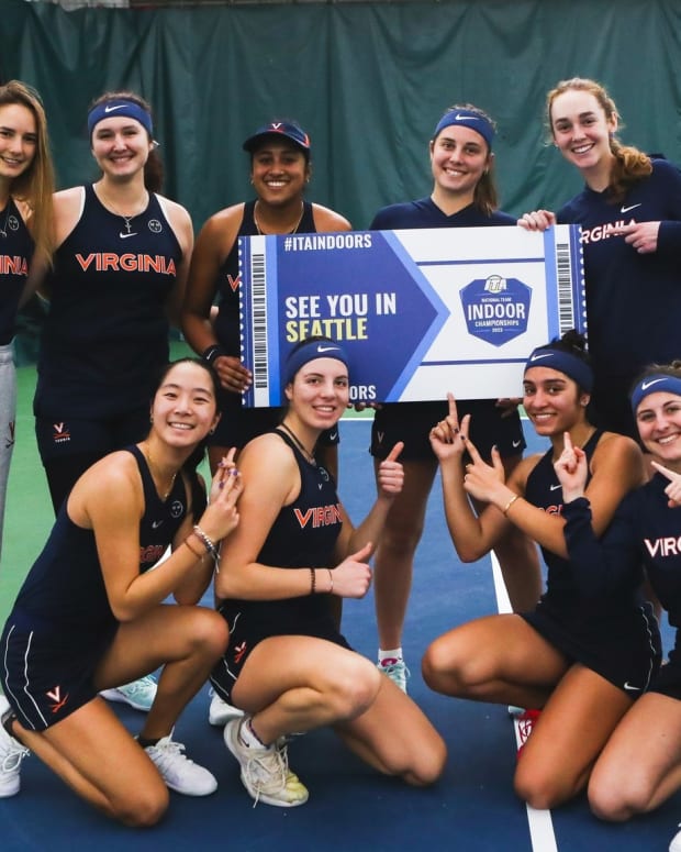 The Virginia women's tennis team celebrates after securing a bid to the 2023 ITA National Indoor Team Championships in Seattle.