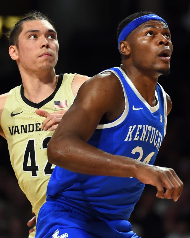 Jan 24, 2023; Nashville, Tennessee, USA; Kentucky Wildcats forward Oscar Tshiebwe (34) and Vanderbilt Commodores forward Quentin Millora-Brown (42) work for positioning on a free throw during the first half at Memorial Gymnasium. Mandatory Credit: Christopher Hanewinckel-USA TODAY Sports
