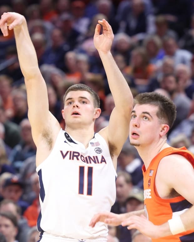Isaac McKneely attempts a three-pointer during the Virginia men's basketball game against Syracuse.