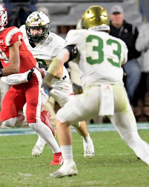 Saraland's KJ Lacey looks to pass against Mountain Brook during the AHSAA Class 6A State Football Championship Game at Jordan Hare Stadium in Auburn, Ala., on Friday December 2, 2022. Ms20
