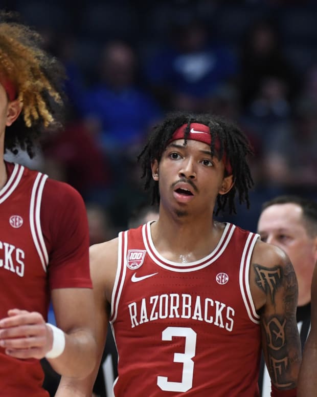 Arkansas men’s basketball players Anthony Black, Nick Smith Jr. and Makhi Mitchell play during the 2023 SEC tournament.