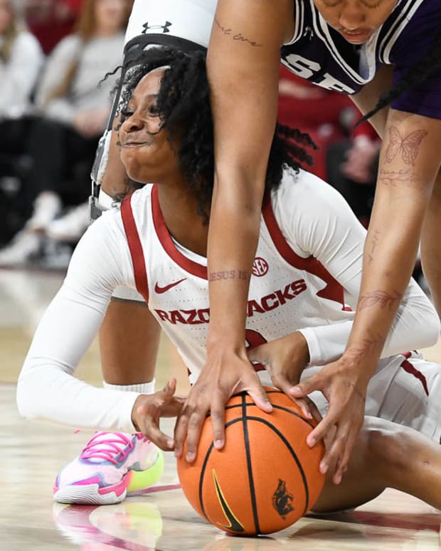 Razorbacks Samara Spencer driving for a loose ball in a win over Stephen F. Austin on Monday night.