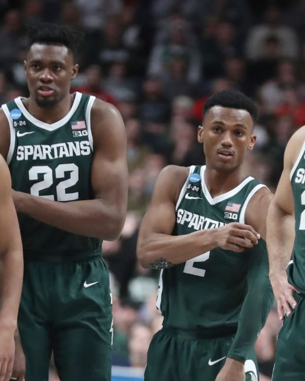 Michigan State men’s basketball players A.J. Hoggard, Mady Sissoko, Tyson Walker and Malik Hal wait for play to begin during the 2023 NCAA men’s tournament Round of 32 game.