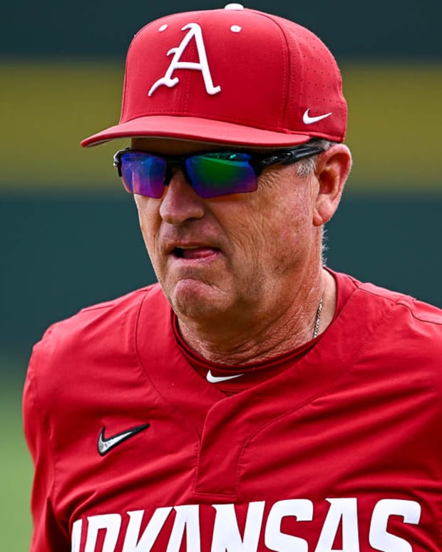 Razorbacks coach Dave Van Horn walks off the field after a 5-4 win over Alabama on Sunday afternoon.
