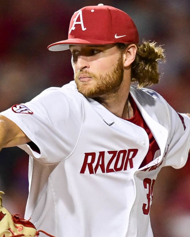 Razorbacks Hunter Hollan on the mound delivering a pitch against Tennessee on Friday night.