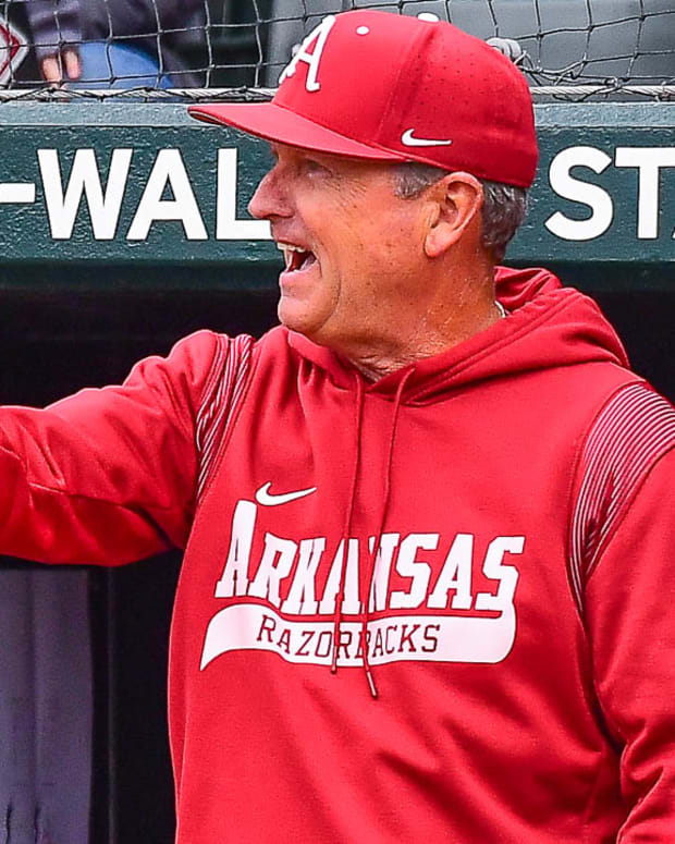 Razorbacks coach Dave Van Horn walks off the field during a pitching change against Texas A&M on Saturday
