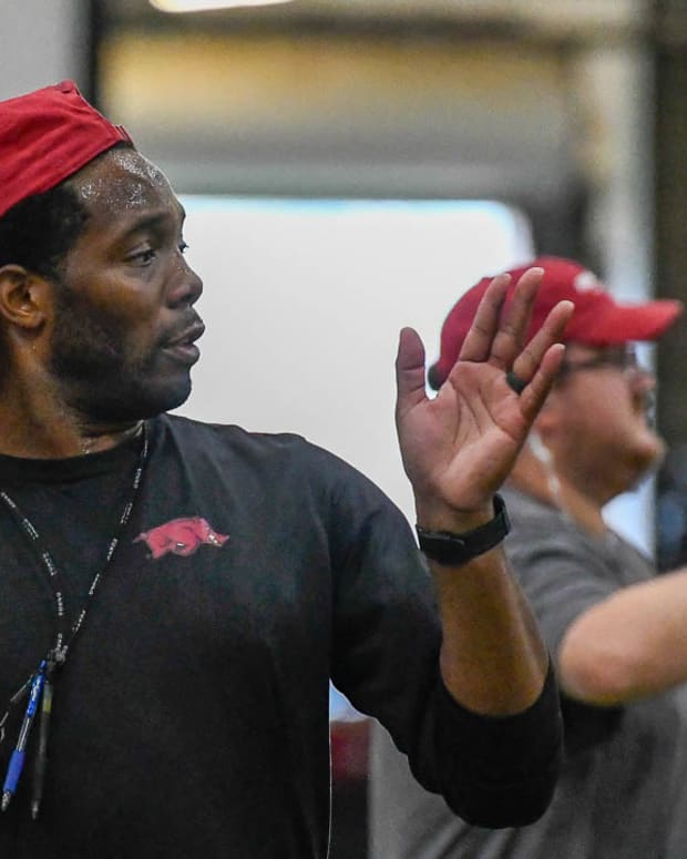 Razorbacks wide receivers coach Kenny Guiton at Tuesday morning's practice