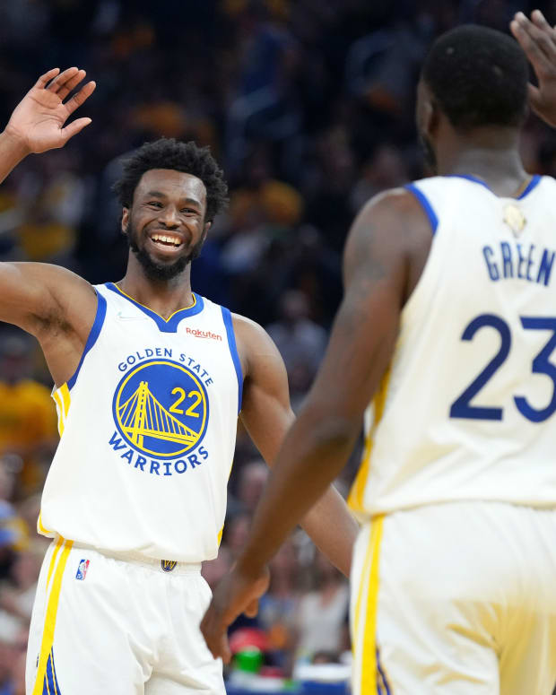 Jun 13, 2022; San Francisco, California, USA; Golden State Warriors forward Andrew Wiggins (22) and forward Draymond Green (23) celebrate during the first half in game five of the 2022 NBA Finals against the Boston Celtics at Chase Center. Mandatory Credit: Kyle Terada-USA TODAY Sports
