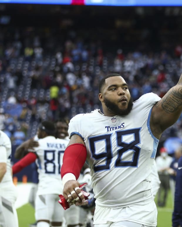 Tennessee Titans defensive end Jeffery Simmons (98) waves to the fans at the end of the game against the Houston Texans at NRG Stadium.