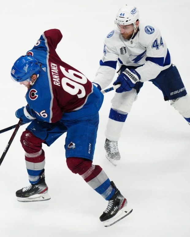 Jun 18, 2022; Denver, Colorado, USA; Colorado Avalanche right wing Mikko Rantanen (96) skates past Tampa Bay Lightning defenseman Jan Rutta (44) during the third period of game two of the 2022 Stanley Cup Final at Ball Arena. Mandatory Credit: Ron Chenoy-USA TODAY Sports