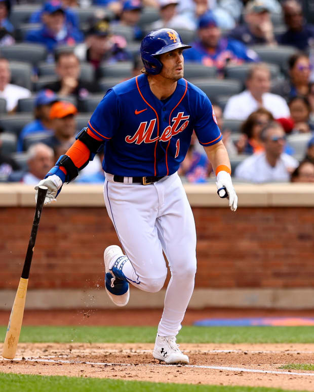 Jun 18, 2022; New York City, New York, USA; New York Mets second baseman Jeff McNeil (1) drops the bat after hitting an RBI single against the Miami Marlins during the second inning at Citi Field.