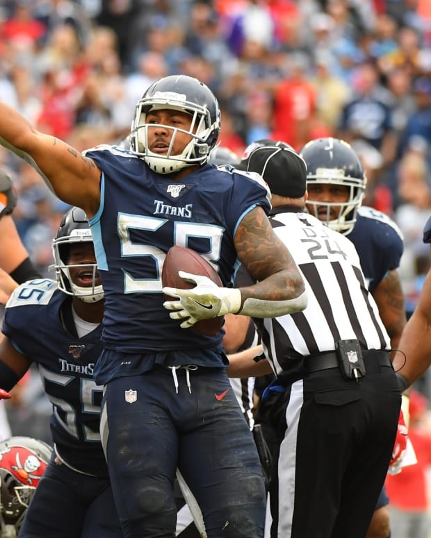 Tennessee Titans linebacker Harold Landry (58) celebrates after forcing and recovering a fumble during the second half against the Tampa Bay Buccaneers at Nissan Stadium.