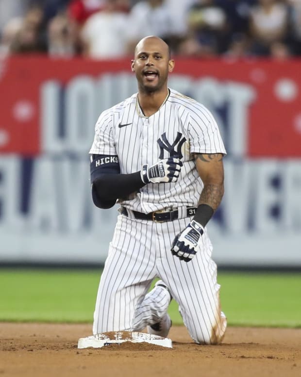 New York Yankees outfielder Aaron Hicks tagged out at second base