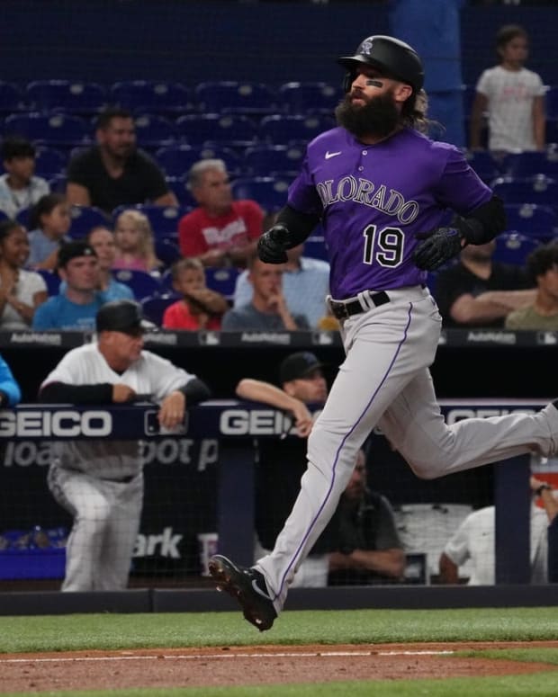 Jun 21, 2022; Miami, Florida, USA; Colorado Rockies designated hitter Charlie Blackmon (19) scores a run in the 3rd inning against the Miami Marlins at loanDepot park. Mandatory Credit: Jasen Vinlove-USA TODAY Sports