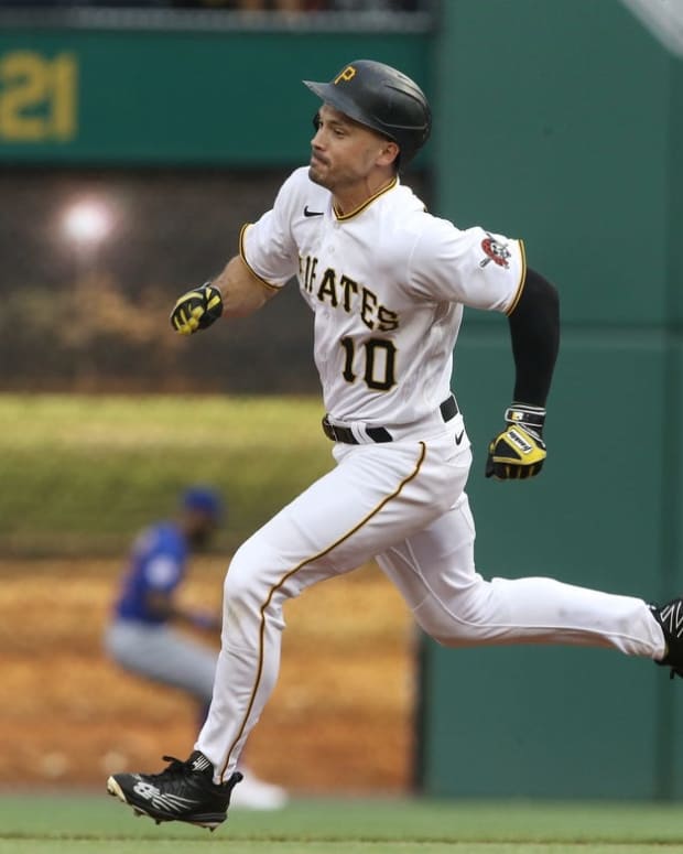 Jun 22, 2022; Pittsburgh, Pennsylvania, USA; Pittsburgh Pirates center fielder Bryan Reynolds (10) runs too third base after hitting a triple against the Chicago Cubs during the first inning at PNC Park. Mandatory Credit: Charles LeClaire-USA TODAY Sports