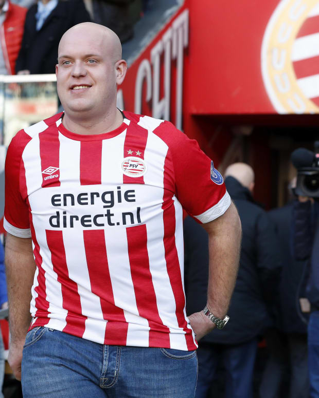 Darts player Michael van Gerwen pictured in a PSV Eindhoven shirt at a Dutch soccer match in 2019