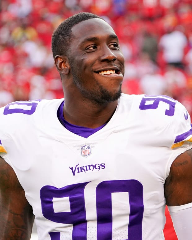 Aug 27, 2021; Kansas City, Missouri, USA; Minnesota Vikings defensive tackle Jalyn Holmes (90) warms up on the sidelines against the Kansas City Chiefs before the game at GEHA Field at Arrowhead Stadium.