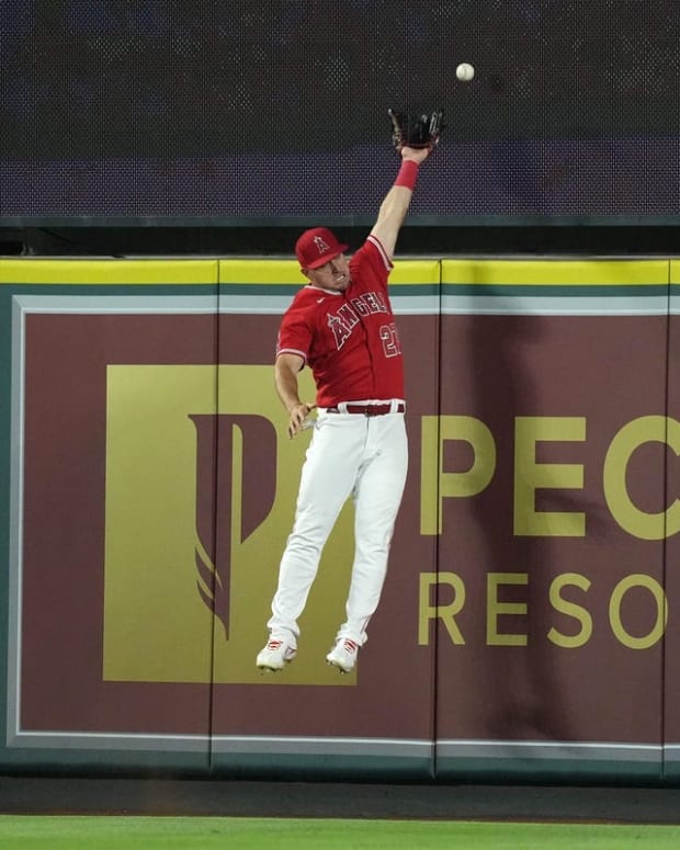 Jun 21, 2022; Anaheim, California, USA; Los Angeles Angels center fielder Mike Trout (27) is unable to catch a two-run home run by Kansas City Royals shortstop Bobby Witt Jr. (not pictured) in the ninth inning at Angel Stadium. Mandatory Credit: Kirby Lee-USA TODAY Sports