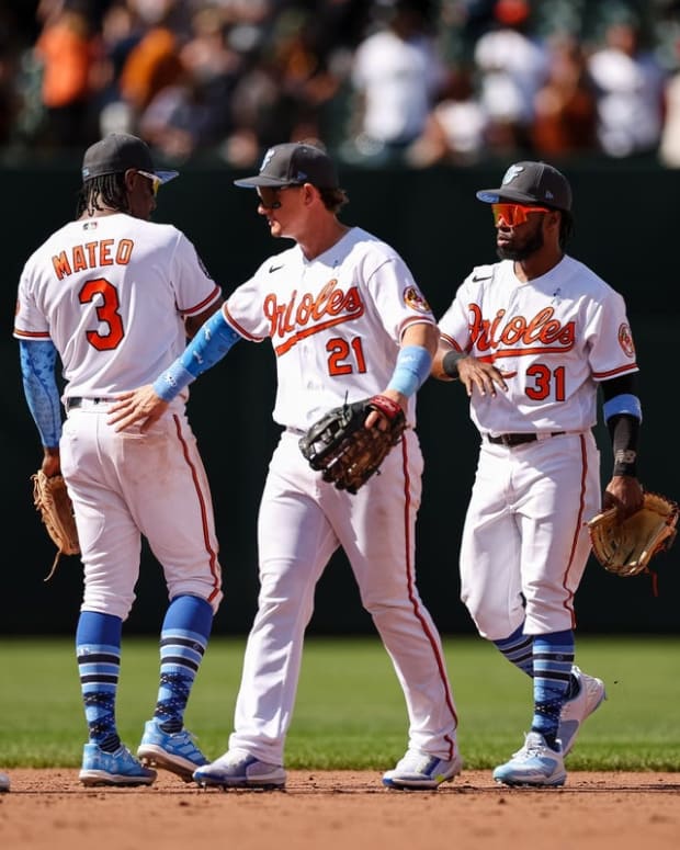 Jun 19, 2022; Baltimore, Maryland, USA; Baltimore Orioles second baseman Rougned Odor (12), shortstop Jorge Mateo (3), left fielder Austin Hays (21), center fielder Cedric Mullins (31), and right fielder Ryan McKenna (26) celebrate after the game against the Tampa Bay Rays at Oriole Park at Camden Yards. Mandatory Credit: Scott Taetsch-USA TODAY Sports