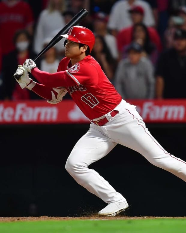 June 25, 2022; Anaheim, California, USA; Los Angeles Angels designated hitter Shohei Ohtani (17) runs after flying out against the Seattle Mariners during the ninth inning at Angel Stadium. Mandatory Credit: Gary A. Vasquez-USA TODAY Sports